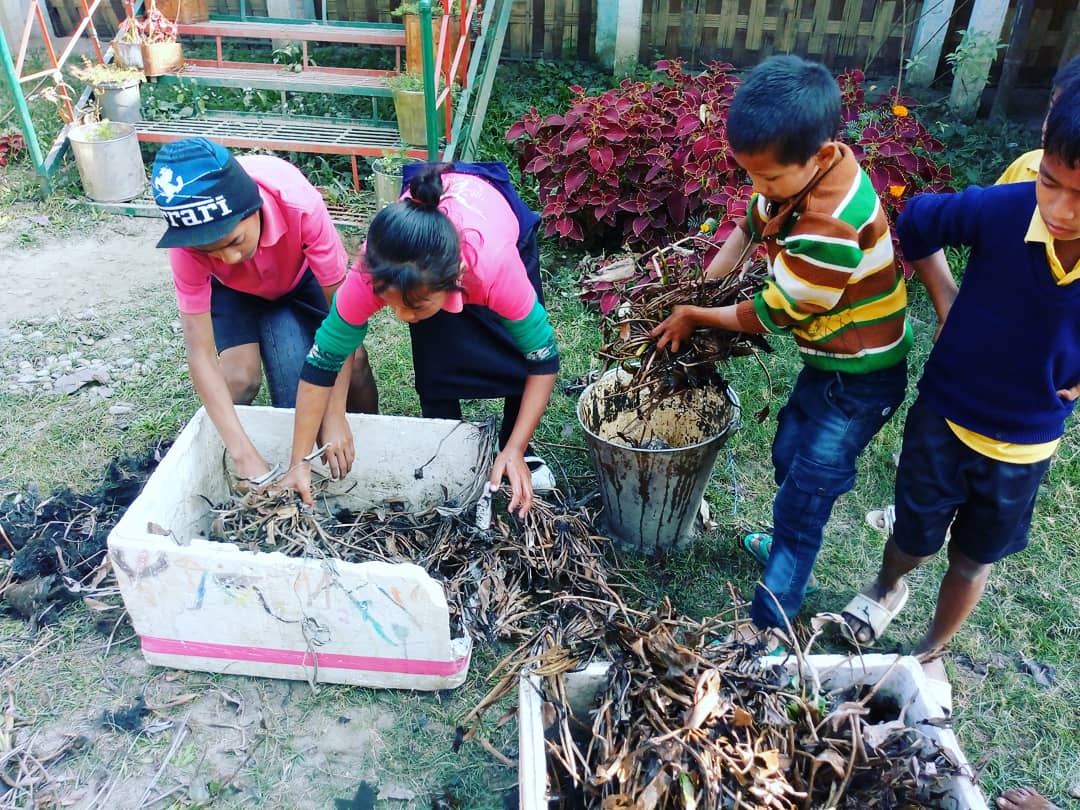 Students are busy working with their vermicompost.