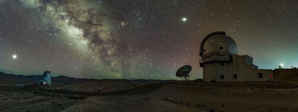 Left to Right are: 1. Mars at Opposition when it is the nearest in 15 years and playing the lead role 2. GROWTH Telescope getting ready in its quest for Transient events. 3. Saturn sitting comfortably near the Milky-Way dark lane. 4. Milky-way. 5. Jupiter towering above the Himalayan Chandra Telescope. 6. Himalayan Chandra Telescope, having already started its quest for understanding of the Universe for the night. 7. Venus setting over National Large Telescope site The occassion was also special since there was planetary alignment of 5 planets with Pluto giving a fleeting/guest apprearance in between Mars and Saturn, not clearly visible in this panorama. Beautiful Red airglow also showing its presence through out the sky. (Source: Dorjey Angchuk)