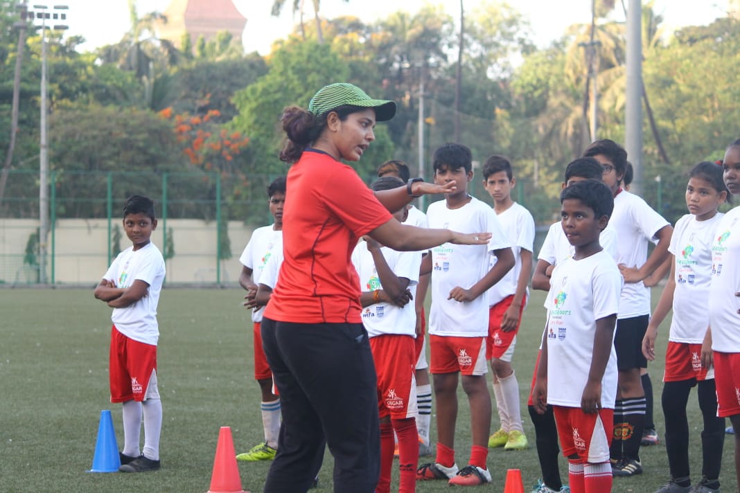 Coaching young kids in Mumbai.