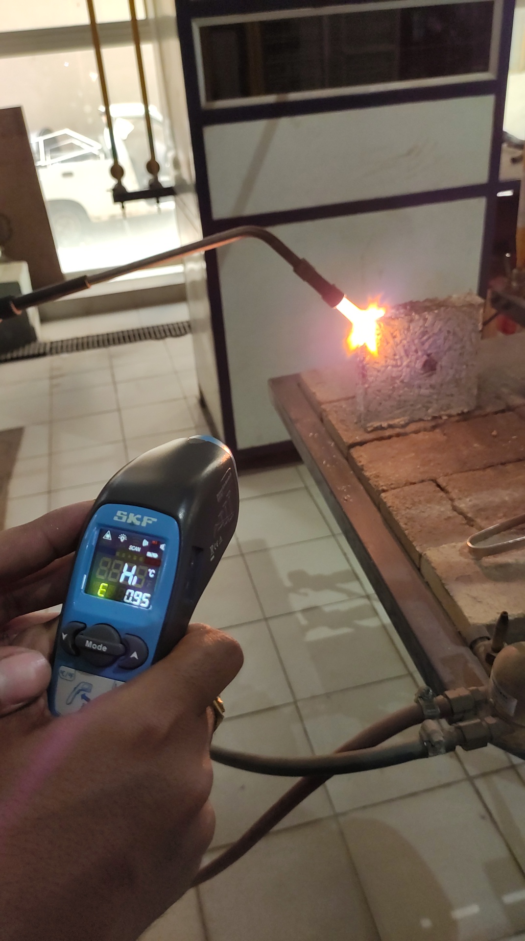 Fire testing being done on the bio-bricks. A 40 mm brick can register fire above 900 degrees and once the flame is removed the fire extinguishes within seconds. (Source: IIT-Hyderabad)